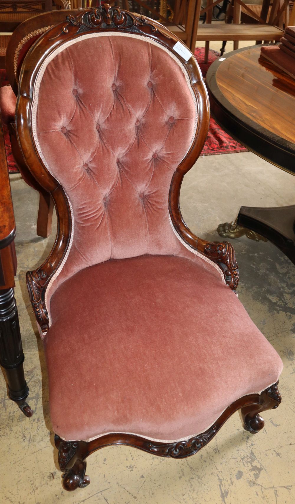 A Victorian walnut pink dralon upholstered spoonback chair